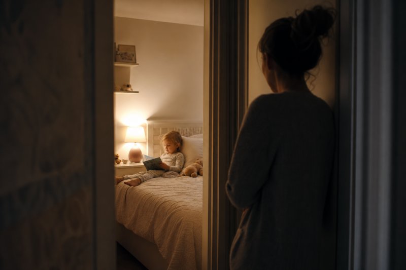 Quiet bedtime moment with baby books creating comfort and connection